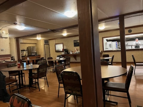A number of tables and chairs with a vintage aesthetic from the Yellowknife Lodge diner
